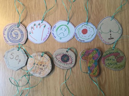 Hand drawn cardboard medallions